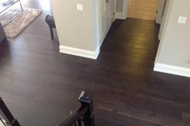 Inspiration for a dark wood floor hallway remodel in Other with beige walls