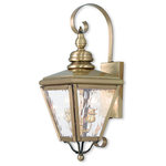 Livex Lighting Lights - Cambridge Outdoor Wall Lantern, Antique Brass - This stylish antique brass outdoor wall lantern is a great way to update your home's exterior decor. A flat metal curved arm attaches the solid brass decorative housing to the square backplate while clear water glass protects the two bulbs.