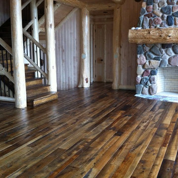 Reclaimed Mixed Hardwood Flooring and Treads in a Log Home Living Room
