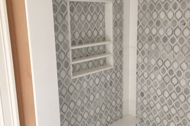 Inspiration for a mid-sized timeless master double-sink bathroom remodel in New York with a freestanding vanity