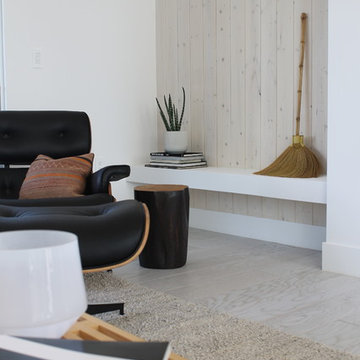Built-in Shelf Near Fireplace with Light Wood Paneling
