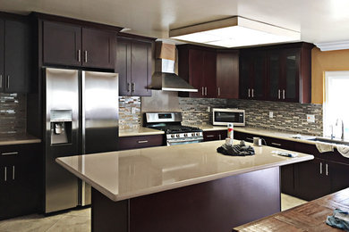 Inspiration for a mid-sized timeless l-shaped ceramic tile open concept kitchen remodel in Orange County with an undermount sink, shaker cabinets, quartz countertops, multicolored backsplash, ceramic backsplash, stainless steel appliances, an island and dark wood cabinets