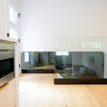 Glass Stair Guard Beside a Built-In Microwave Drawer | North York