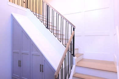 Example of a large transitional wooden l-shaped mixed material railing staircase design in Other with painted risers