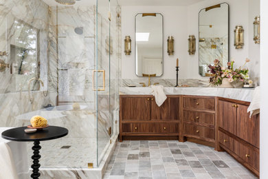 Transitional master stone slab and beige tile multicolored floor and double-sink bathroom photo in Seattle with dark wood cabinets, a hinged shower door, beige countertops, a niche, a built-in vanity, beige walls and beaded inset cabinets