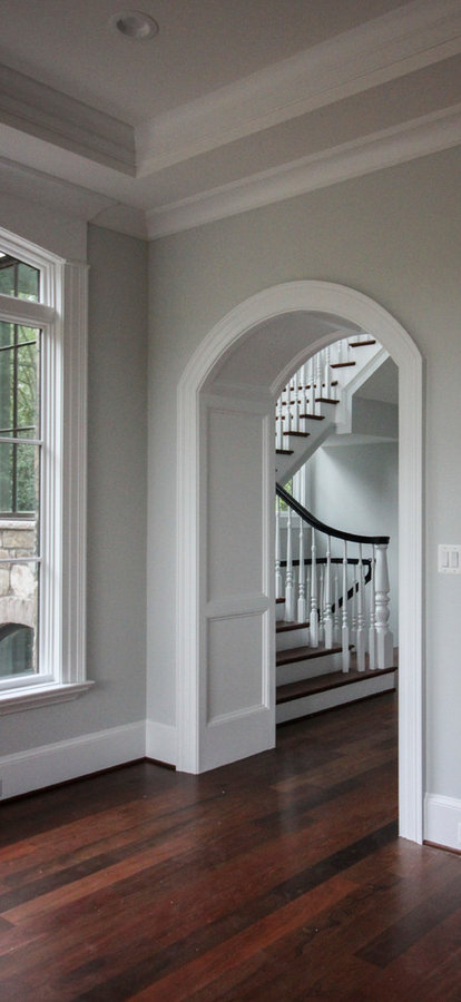 Powerful Impression by Floating Staircase in Suburban Foyer