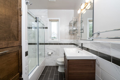 Bathroom - mid-sized contemporary 3/4 marble tile and white tile black floor, vinyl floor and single-sink bathroom idea in DC Metro with an integrated sink, dark wood cabinets, gray walls, white countertops, quartz countertops and shaker cabinets