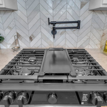 Laguna Niguel Kitchen with Gas Range, Pot Filler & Herringbone Backsplash