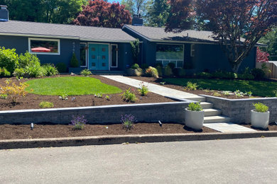 Photo of a mid-sized contemporary retaining wall landscape in Portland.