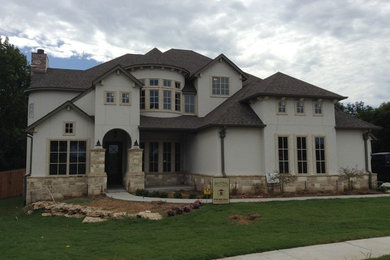 Inspiration for a large mediterranean gray two-story exterior home remodel in Other