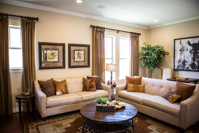 Inspiration for a mid-sized transitional open concept medium tone wood floor living room remodel in Austin with beige walls and a wall-mounted tv