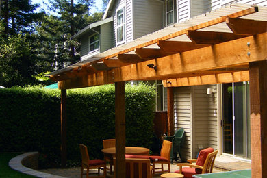 Inspiration for a contemporary backyard patio in San Francisco with a pergola.