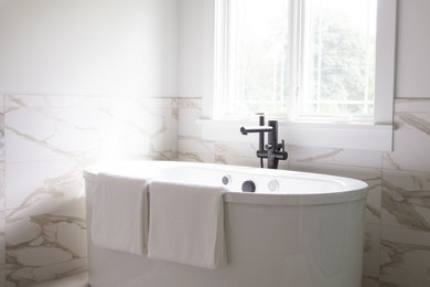 Example of a large transitional bathroom design in Other