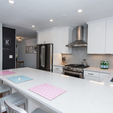 Kitchen opens back up to entry with a new chalkboard scheduler for the entire fa