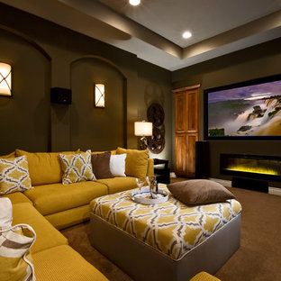 Photo of a traditional home cinema in Austin with brown walls, carpet, a projector screen and brown floors.