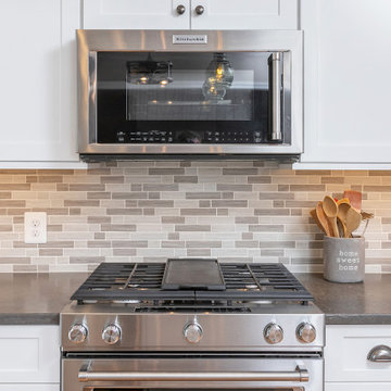 Kitchen with White Shaker Cabinetry (and WIne Rack & open shelving)