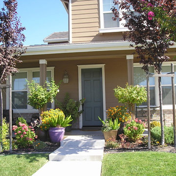 Colorful pots at farmhouse front entry