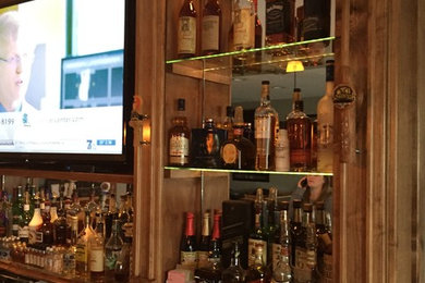 Example of a transitional home bar design in Other
