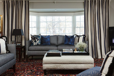 Inspiration for a mid-sized transitional open concept medium tone wood floor living room remodel in Toronto with blue walls, a standard fireplace, a stone fireplace and a tv stand