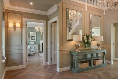 Expansive traditional hallway in Dublin with grey walls and medium hardwood floors.