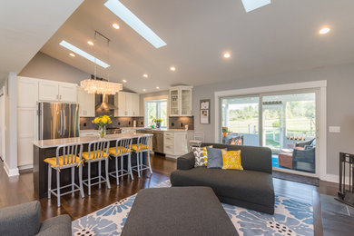 Family room - mid-sized contemporary open concept dark wood floor family room idea in Detroit with gray walls, a standard fireplace, a stone fireplace and a tv stand