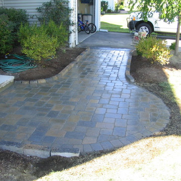 Ideal Millstone paver with curbstone edging along beds.