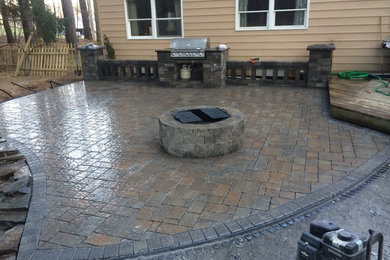 Mid-sized backyard brick patio kitchen photo in Boston with no cover