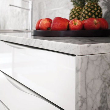 Modern white gloss kitchen with black island