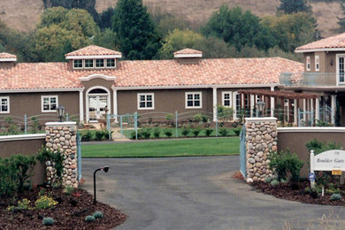 Mountain style two-story stucco exterior home photo in San Francisco