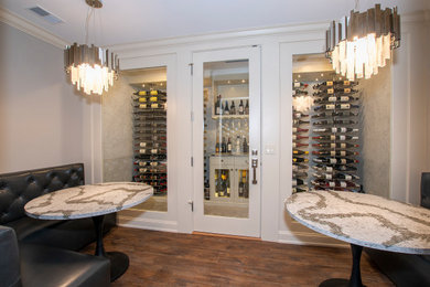 Example of a minimalist wine cellar design in Detroit with display racks
