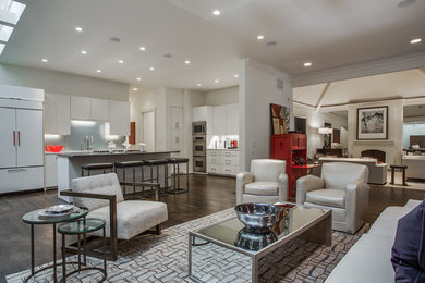 Living room - mid-sized modern open concept dark wood floor living room idea in Dallas with white walls, no fireplace and a concealed tv