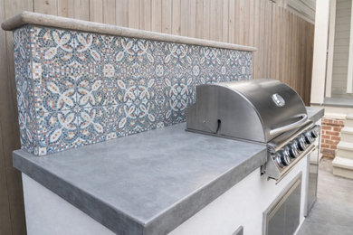Mid-sized backyard patio kitchen photo in Houston