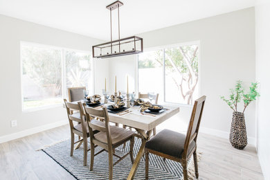 Enclosed dining room - mid-sized transitional porcelain tile and gray floor enclosed dining room idea in Phoenix with gray walls