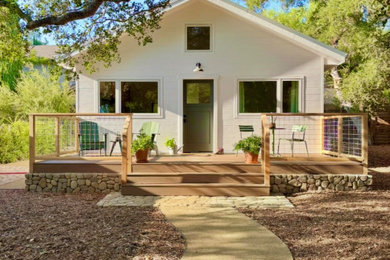 Small farmhouse white one-story concrete fiberboard and clapboard exterior home idea in Los Angeles with a metal roof and a gray roof