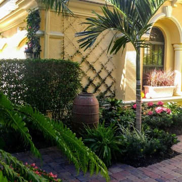 Landscape detailing with a wall espalier, containers, 'found' objects