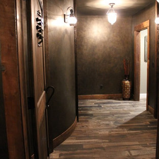 Inspiration for a medium sized rustic enclosed home cinema in Boston with porcelain flooring, brown floors, a projector screen and grey walls.