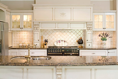 This is an example of a mid-sized traditional single-wall eat-in kitchen in Perth with a double-bowl sink, shaker cabinets, granite benchtops, ceramic splashback, black appliances, medium hardwood floors and a peninsula.