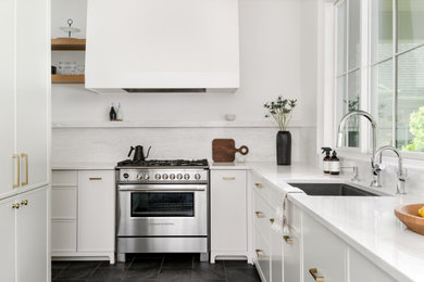 Example of a transitional kitchen design in Toronto