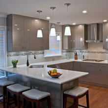 Grey kitchen cabinets and backsplashes