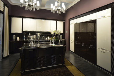 Design ideas for a large contemporary l-shaped eat-in kitchen in Moscow with a drop-in sink, raised-panel cabinets, black cabinets, marble benchtops, black splashback, marble splashback, stainless steel appliances, medium hardwood floors, with island, black floor and black benchtop.