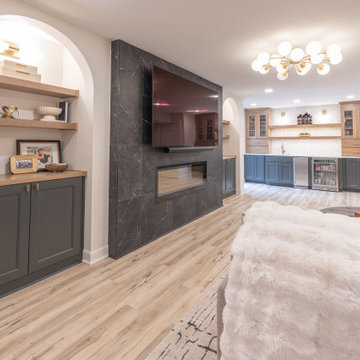 Warm & Inviting Basement Retreat with Custom Bar + Entertainment Center