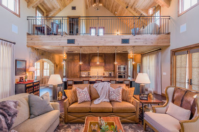 Living room - rustic open concept and formal medium tone wood floor living room idea in Austin with white walls, no fireplace and no tv