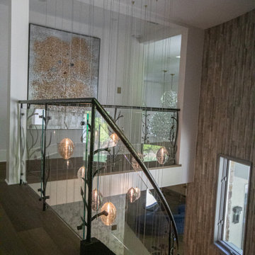 NATURE'S EMBRACE OF IRON AND GLASS RAILING