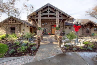 Mid-sized rustic beige one-story mixed siding gable roof idea in San Luis Obispo