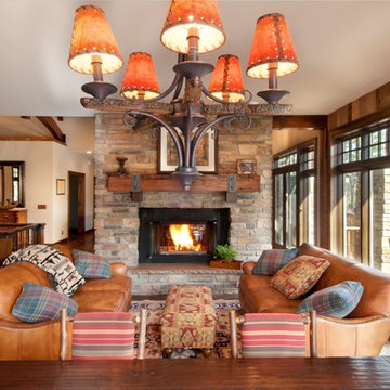 Reclaimed Douglas Fir Mantel with Iron Straps in Rustic Stone Fireplace Room