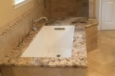 Walk-in shower - mid-sized traditional master beige tile and porcelain tile porcelain tile walk-in shower idea in Other with an undermount sink, furniture-like cabinets, dark wood cabinets, granite countertops, an undermount tub, a one-piece toilet and beige walls