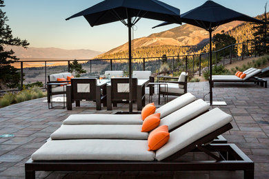 Inspiration for a mid-sized contemporary backyard concrete patio remodel in Los Angeles with a fire pit and no cover