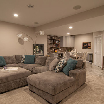 Basement With Entertainment Area for Family With Traditional Style Kitchenette