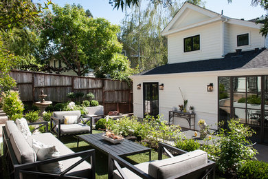 This is an example of a victorian drought-tolerant and full sun backyard water fountain landscape in San Francisco for summer.