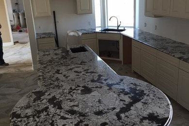 Elegant kitchen photo in San Diego with an undermount sink
